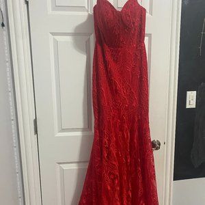 Strapless, mermaid style, corset red lace and gem prom dress. Worn once.